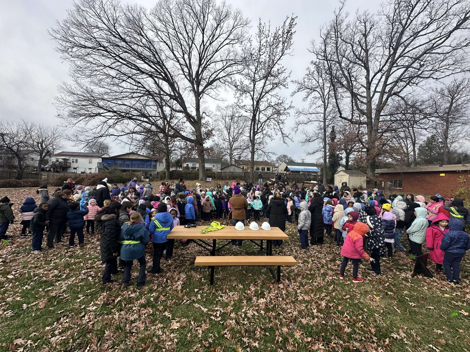 The whole school gathered around the first bench at the Wildcat Way groundbreaking